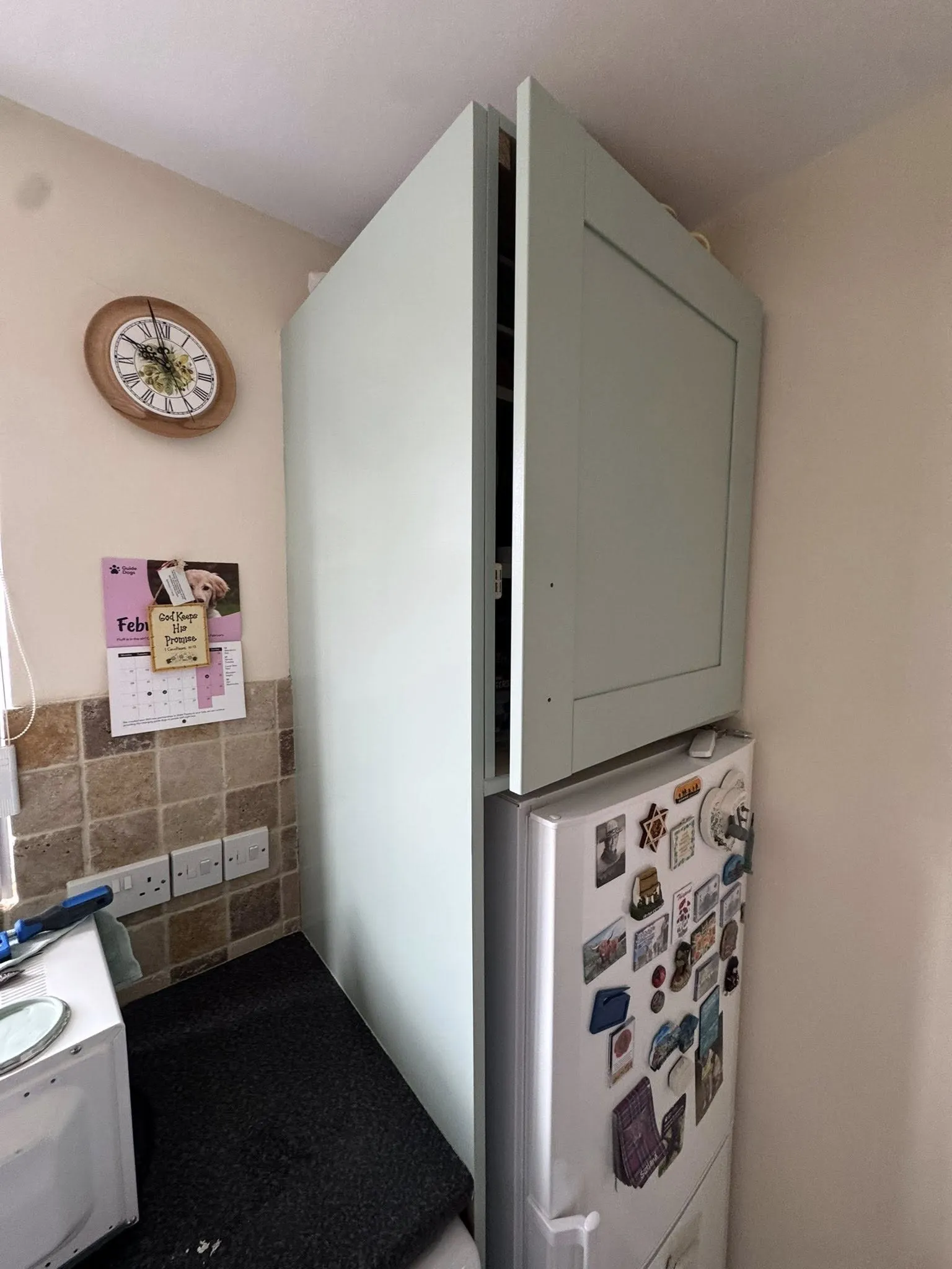 Light green painted cupboards